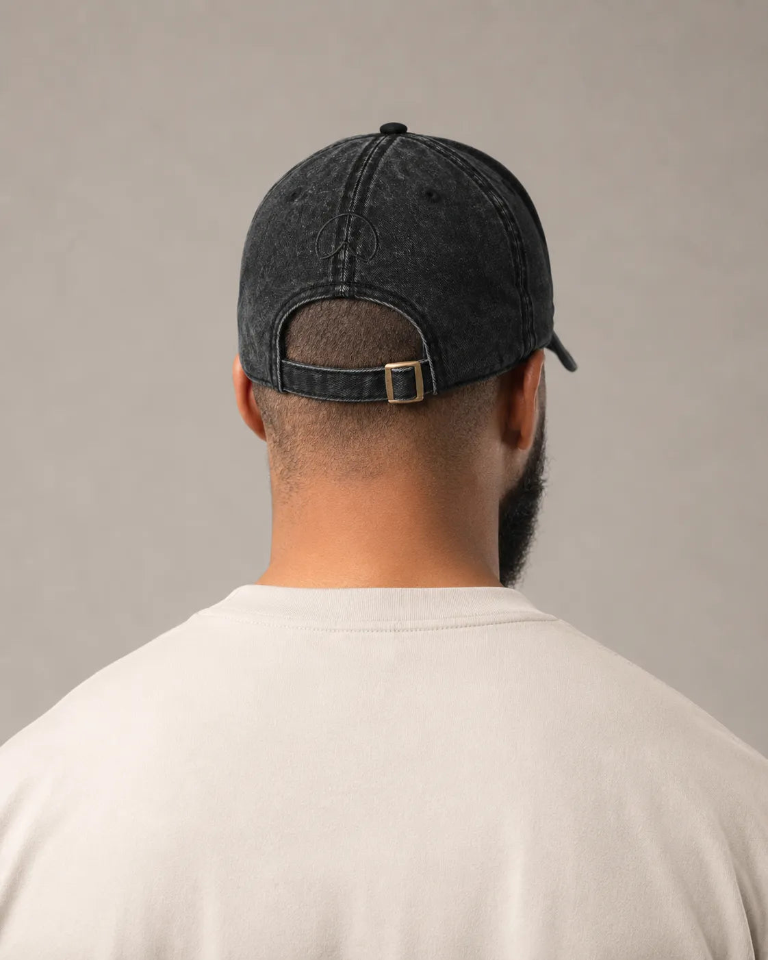Rear view of the BRTLS Black Presence Vintage Cap showing adjustable strap and vintage washed cotton texture