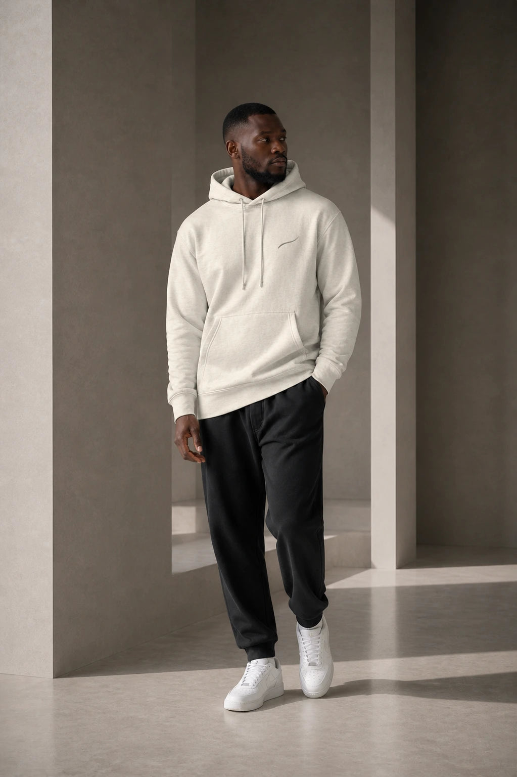 BRTLS Core Hoodie Bone showcasing the relaxed fit and everyday silhouette