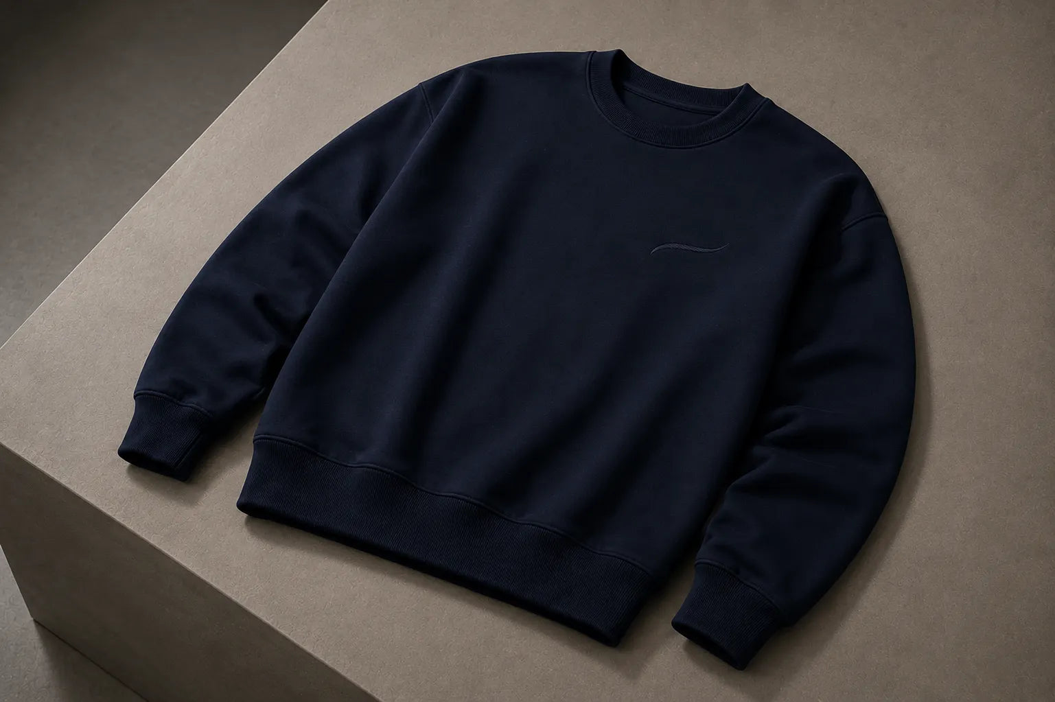 BRTLS Core Sweatshirt Navy flatlay product photography highlighting premium heavyweight fleece fabric, tonal embroidery and minimalist Scandinavian design.