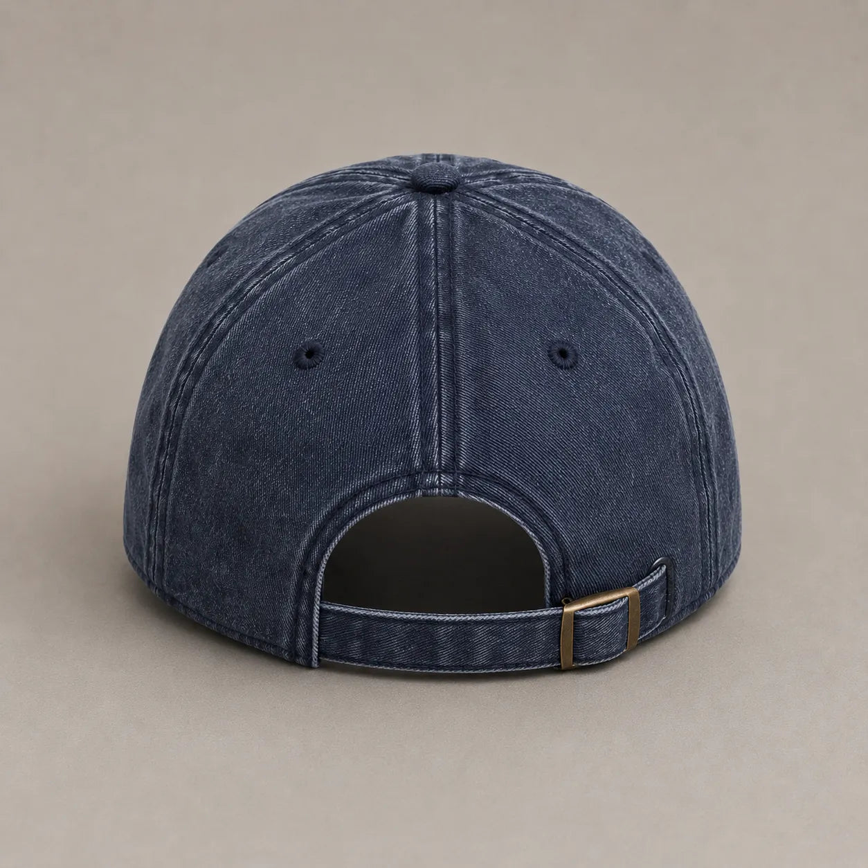 Rear view of the BRTLS Navy Presence Vintage Cap showing adjustable strap and antique brass buckle