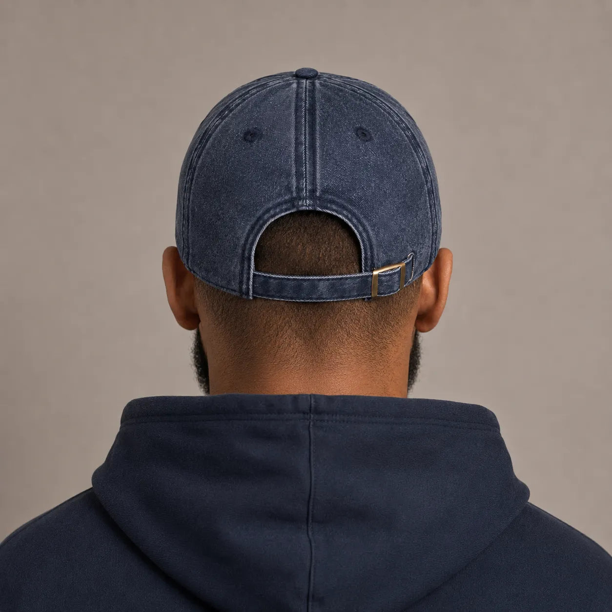 Man from the back wearing the BRTLS Navy Presence Vintage Cap with tonal embroidery and vintage washed finish