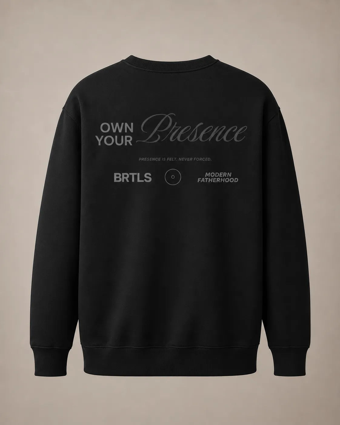 Back view of the black BRTLS Own Your Presence sweatshirt with tonal oversized typography artwork and modern fatherhood detailing