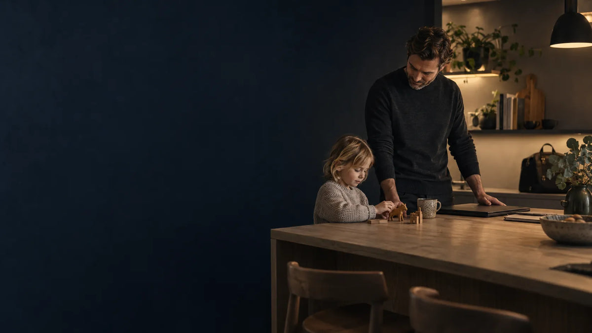 Father at home with his child after finishing work for the day.