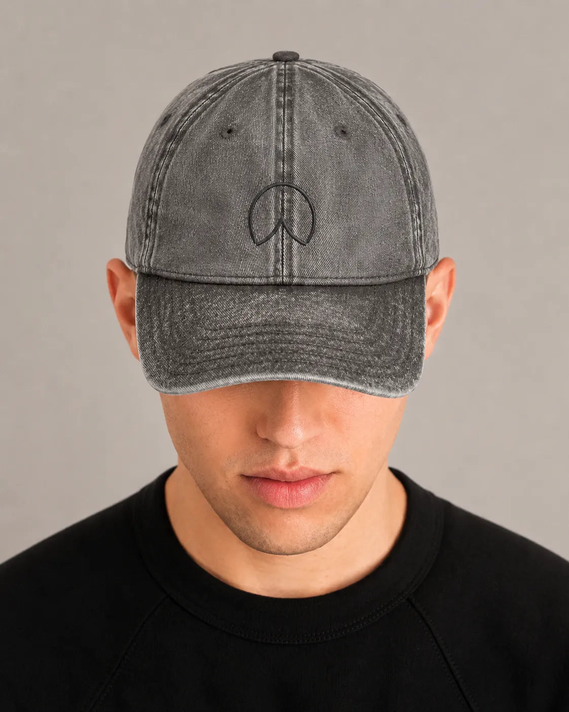 Man wearing the BRTLS Charcoal Grey Presence Vintage Cap with tonal embroidery and vintage washed finish