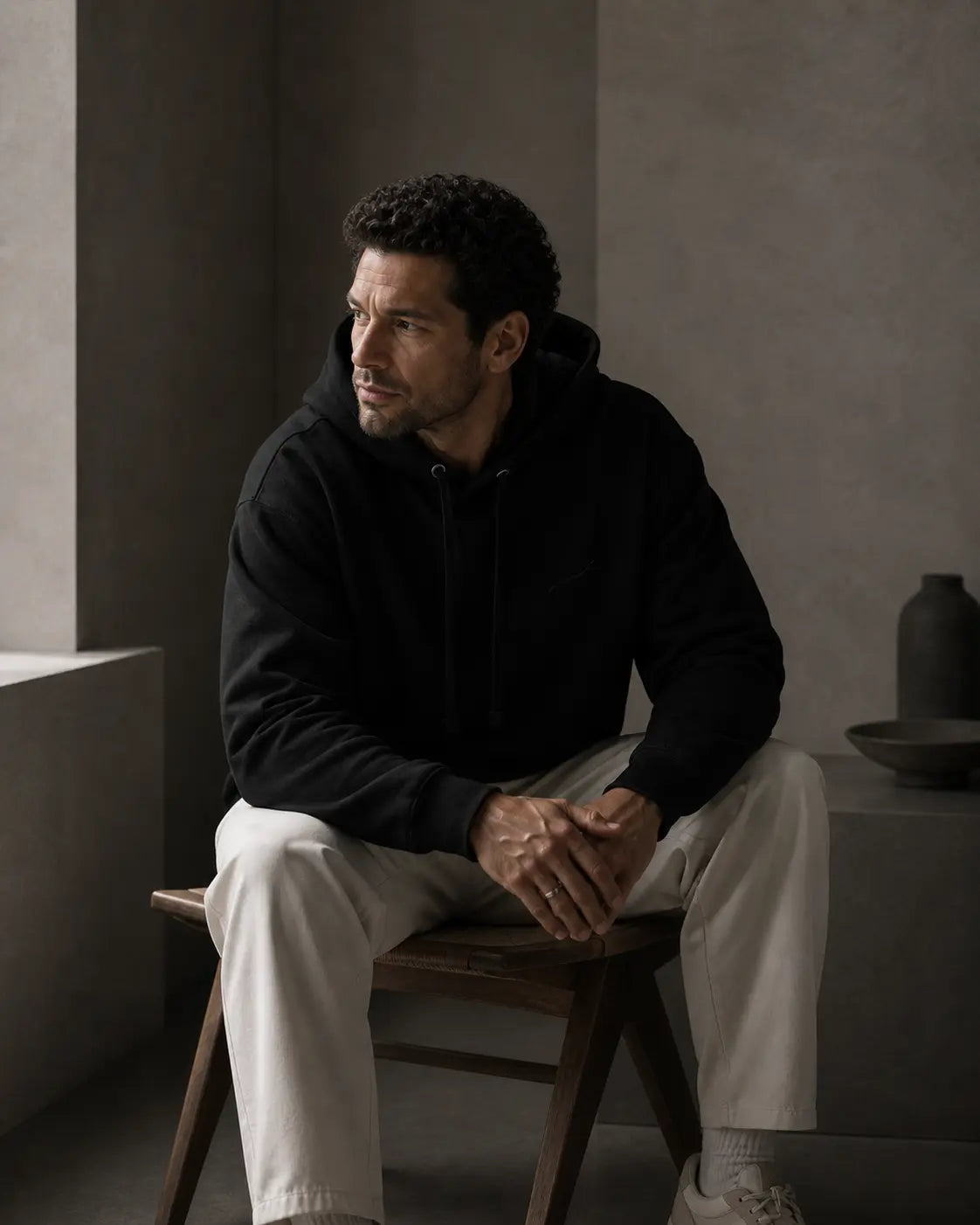 BRTLS Core Hoodie Black editorial lifestyle portrait highlighting quiet luxury menswear and intentional living