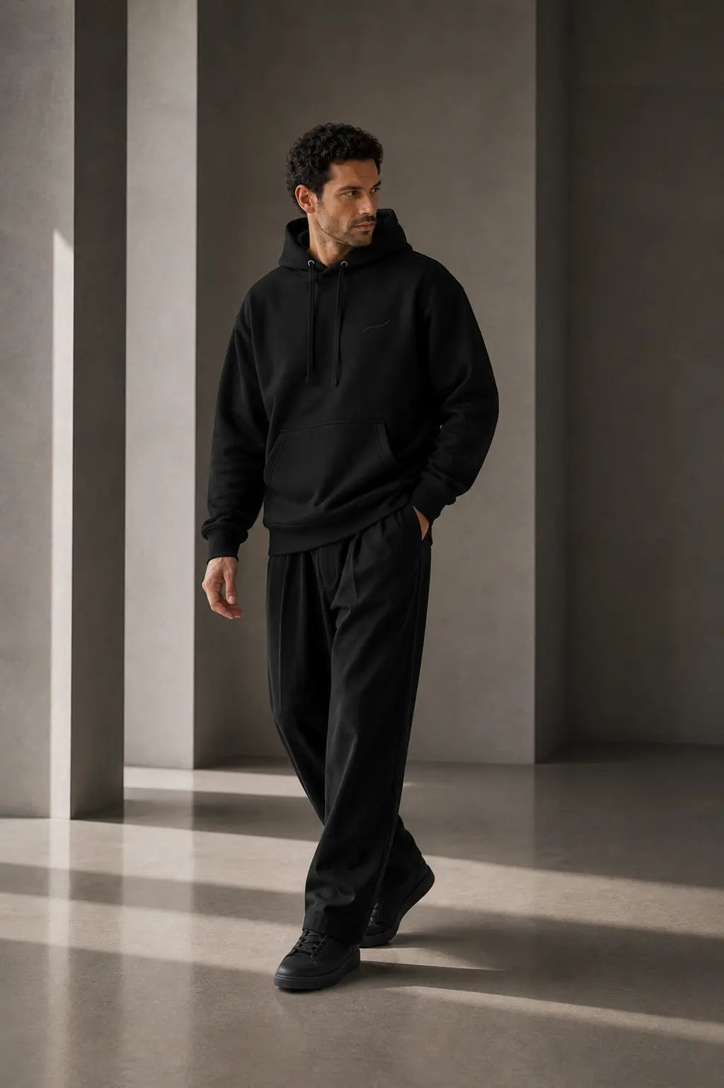 BRTLS Core Hoodie Black full body fit image showing relaxed tailored silhouette and premium everyday wear