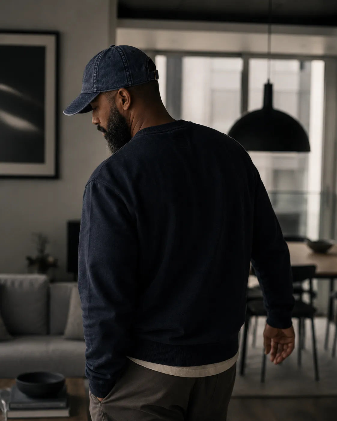 Premium lifestyle photography featuring the BRTLS Navy Presence Vintage Cap and intentional menswear styling