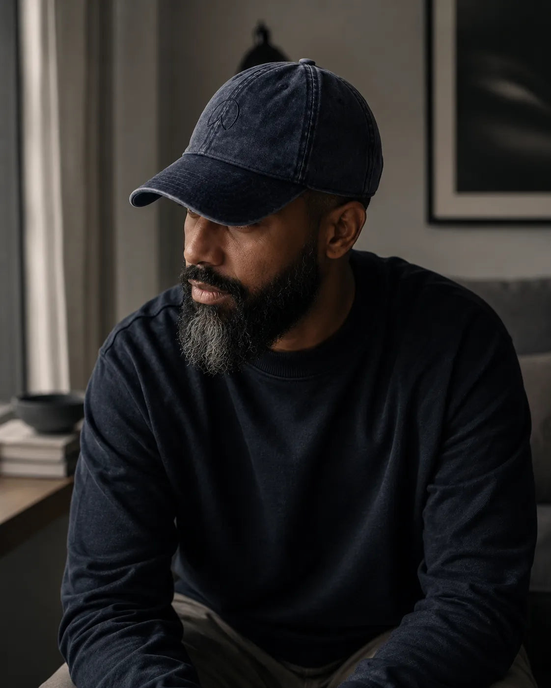 Modern father wearing the BRTLS Navy Presence Vintage Cap in a minimalist interior
