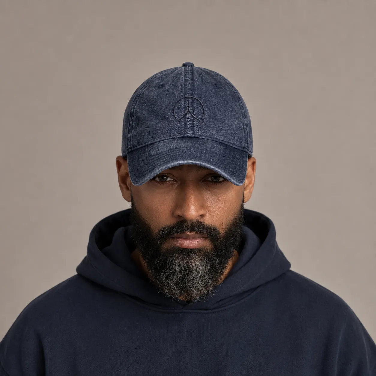 Man wearing the BRTLS Navy Presence Vintage Cap with tonal embroidery and vintage washed finish