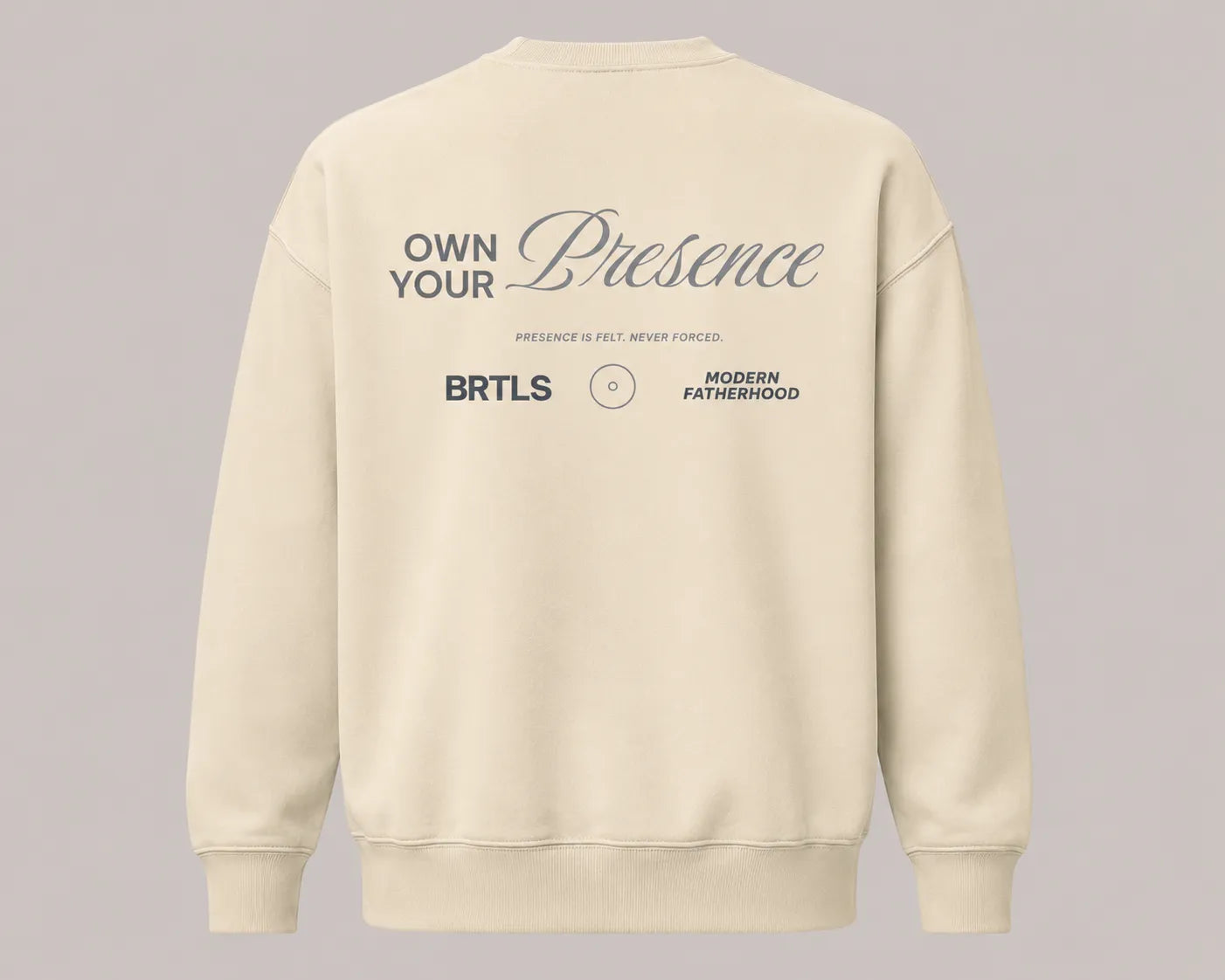 Back view of the BRTLS Own Your Presence sweatshirt in bone with tonal graphic artwork