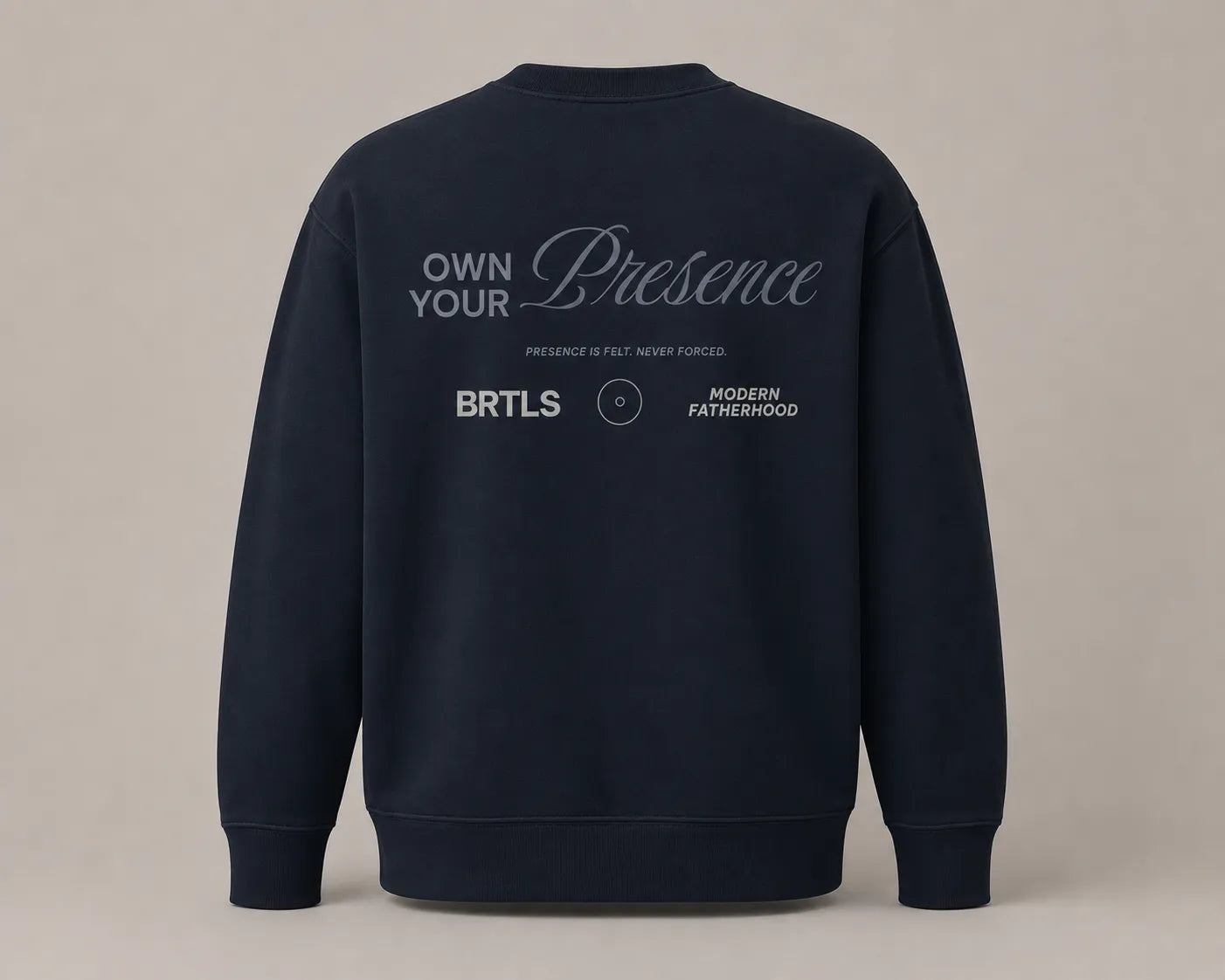 Back flatlay of BRTLS Own Your Presence Navy Sweatshirt with tonal Presence artwork and minimalist luxury aesthetic
