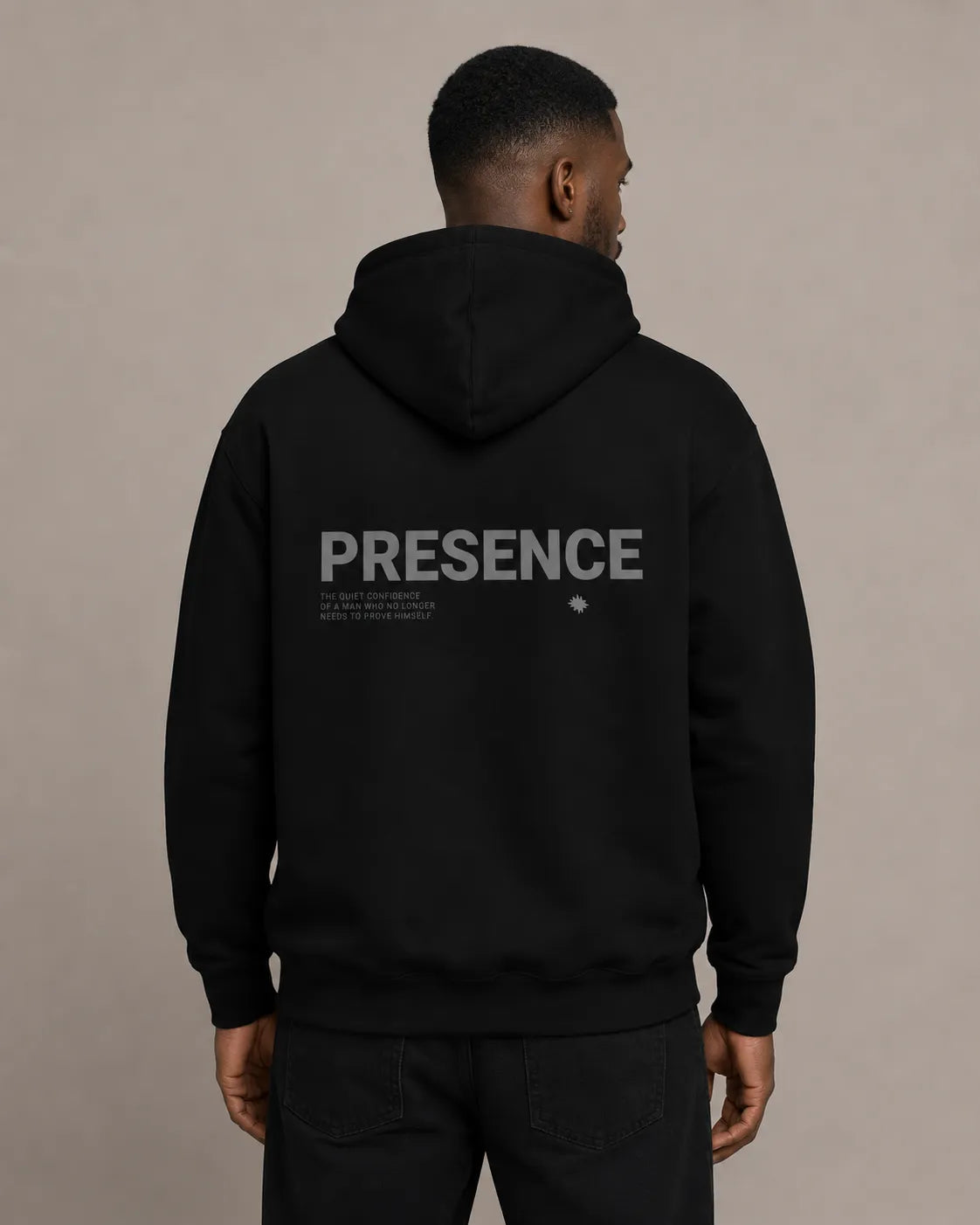 Back view of The Presence Hoodie Black by BRTLS featuring tonal Presence artwork and understated modern styling