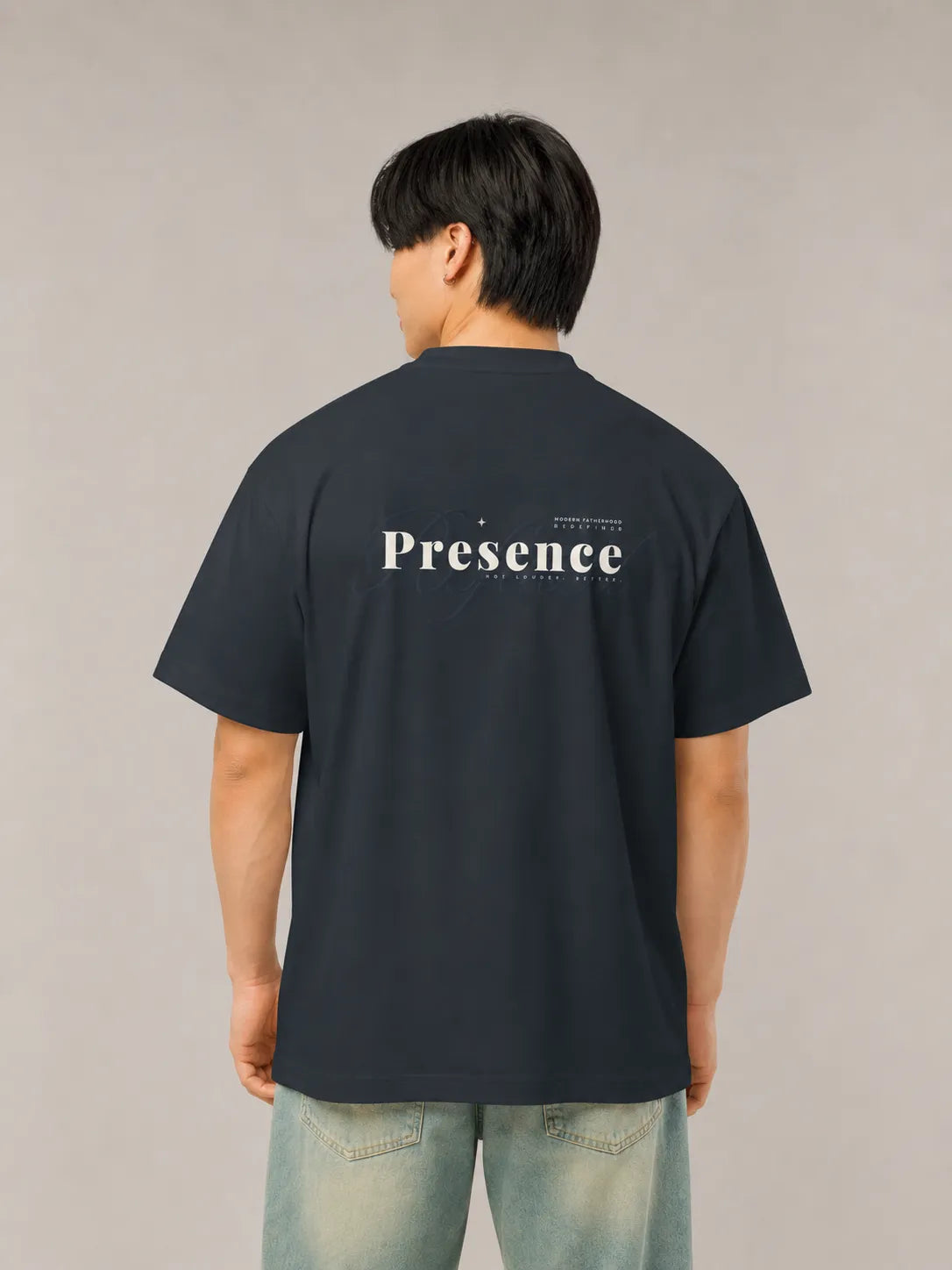 Back view of the BRTLS Refined Presence Tee Navy Blazer showing tonal Presence artwork and oversized relaxed silhouette