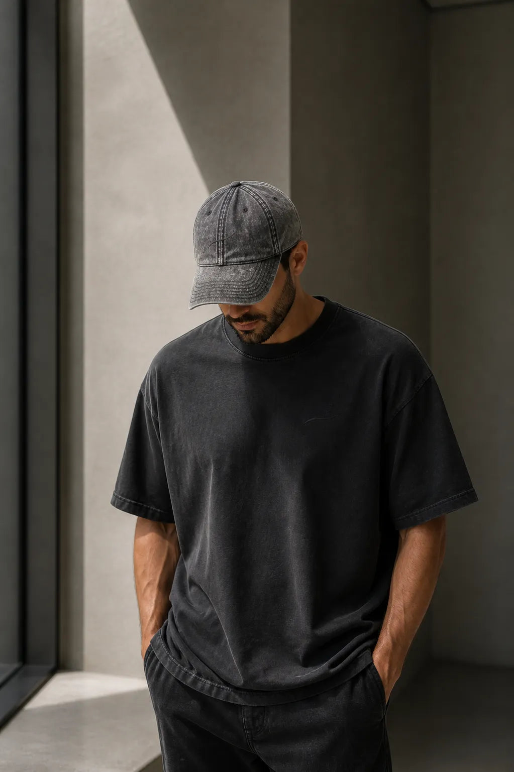 Core Vintage Cap Charcoal Grey worn by modern father in minimalist architectural setting